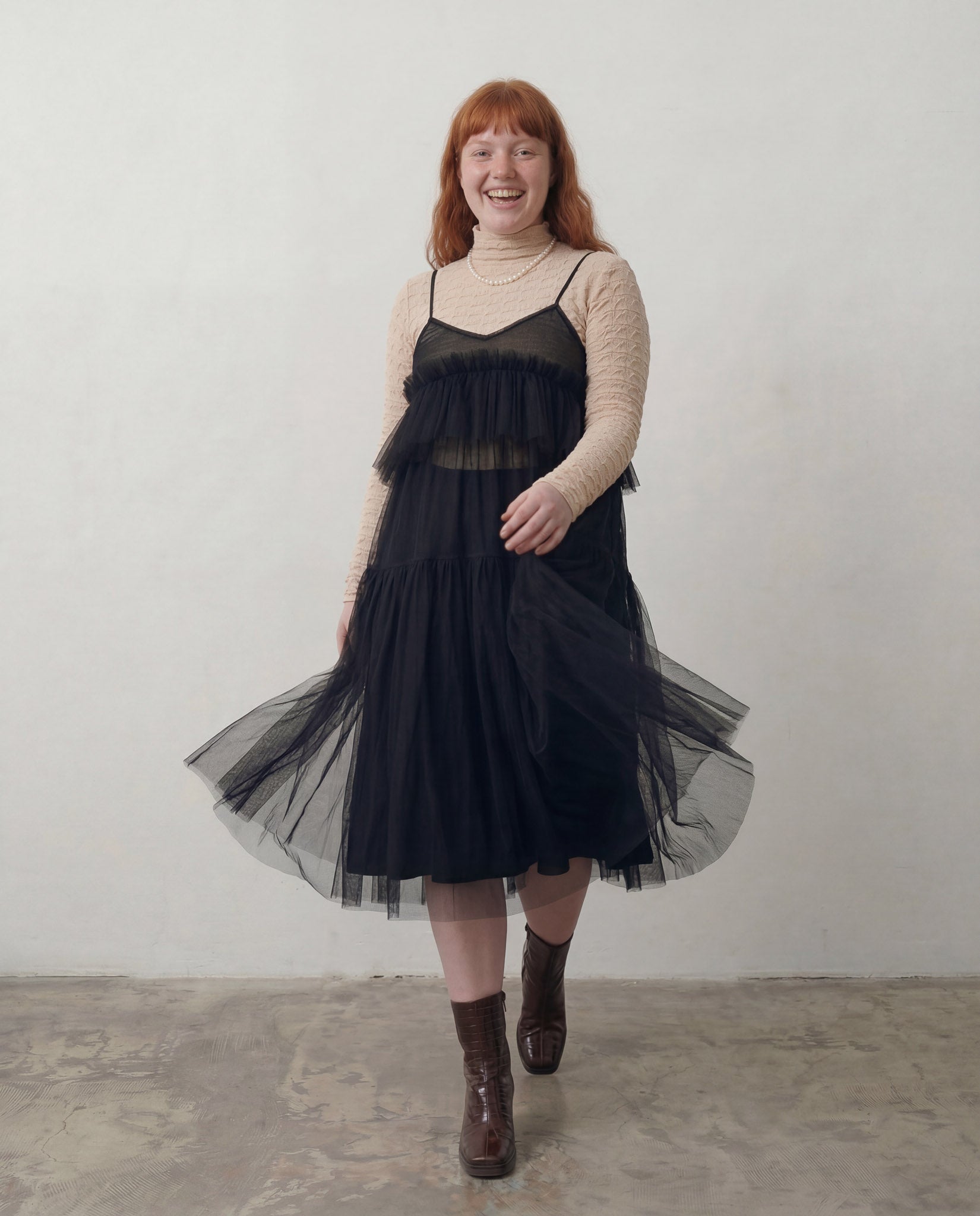 ALEX S. YU Georgia tulle dress in black featuring a voluminous, tiered silhouette and sheer ruffled layers.