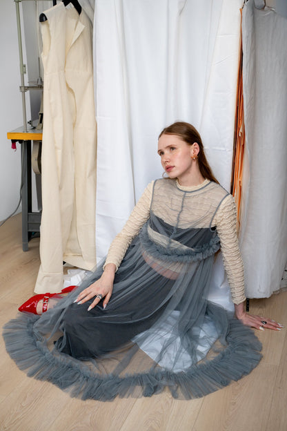 The Lula tulle dress in grey showing the midi-length gathered skirt and semi-sheer bodice detailing with a contemporary fit.