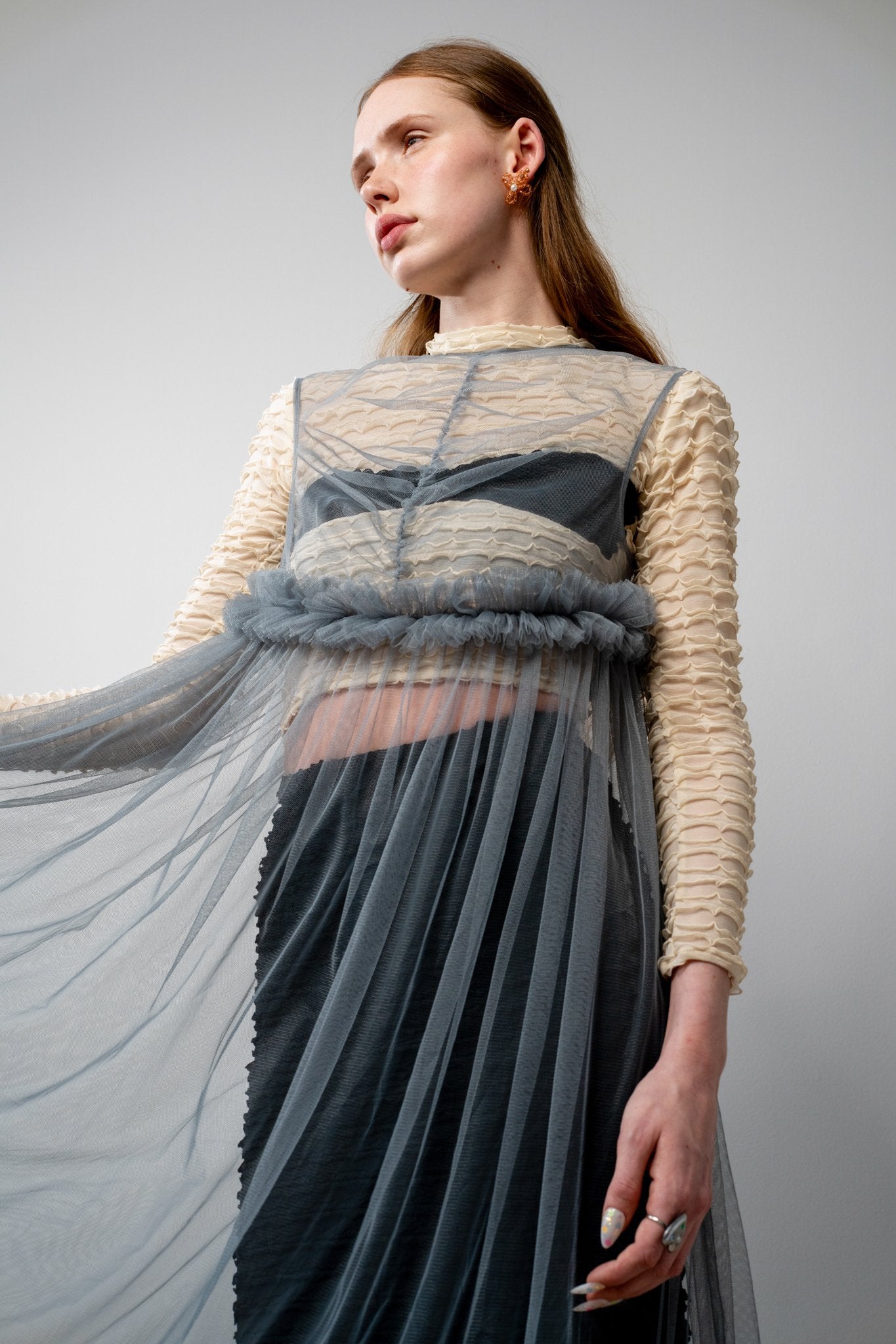 The Lula tulle dress in grey showing the midi-length gathered skirt and semi-sheer bodice detailing with a contemporary fit.