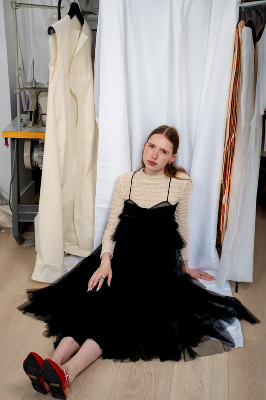 ALEX S. YU Georgia tulle dress in black featuring a voluminous, tiered silhouette and sheer ruffled layers.