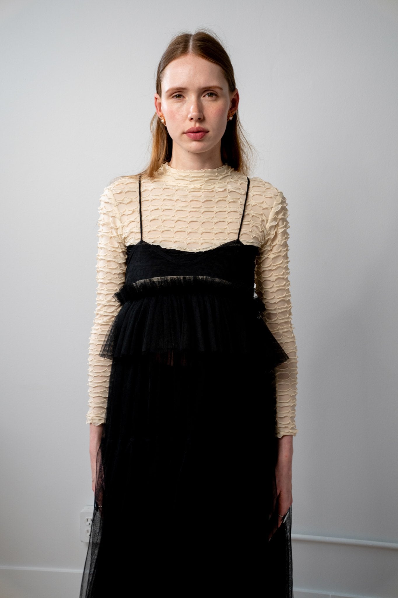 ALEX S. YU Georgia tulle dress in black featuring a voluminous, tiered silhouette and sheer ruffled layers.