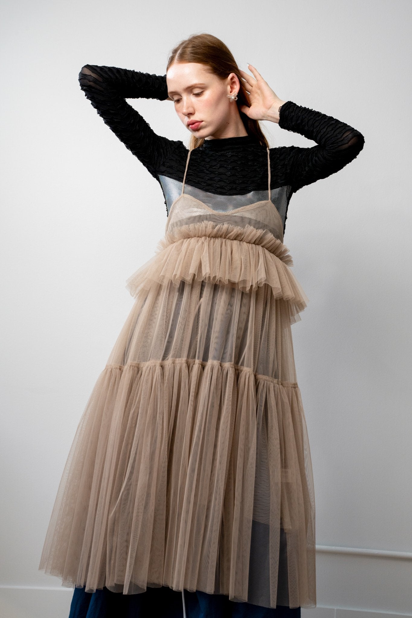 Full-length Georgia tulle dress in a soft beige tone with delicate tiers and a ethereal drape from the core collection.