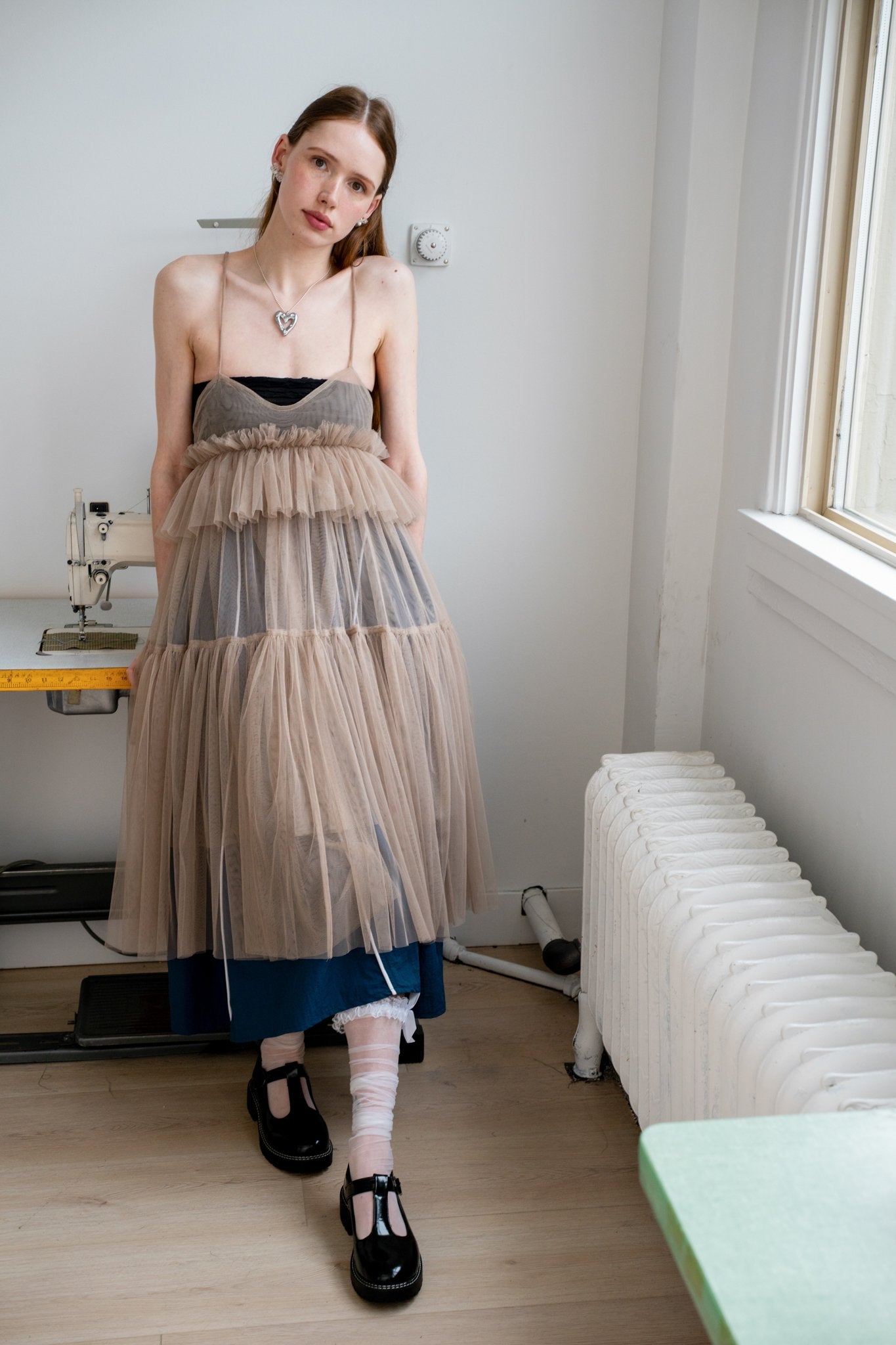 Full-length Georgia tulle dress in a soft beige tone with delicate tiers and a ethereal drape from the core collection.