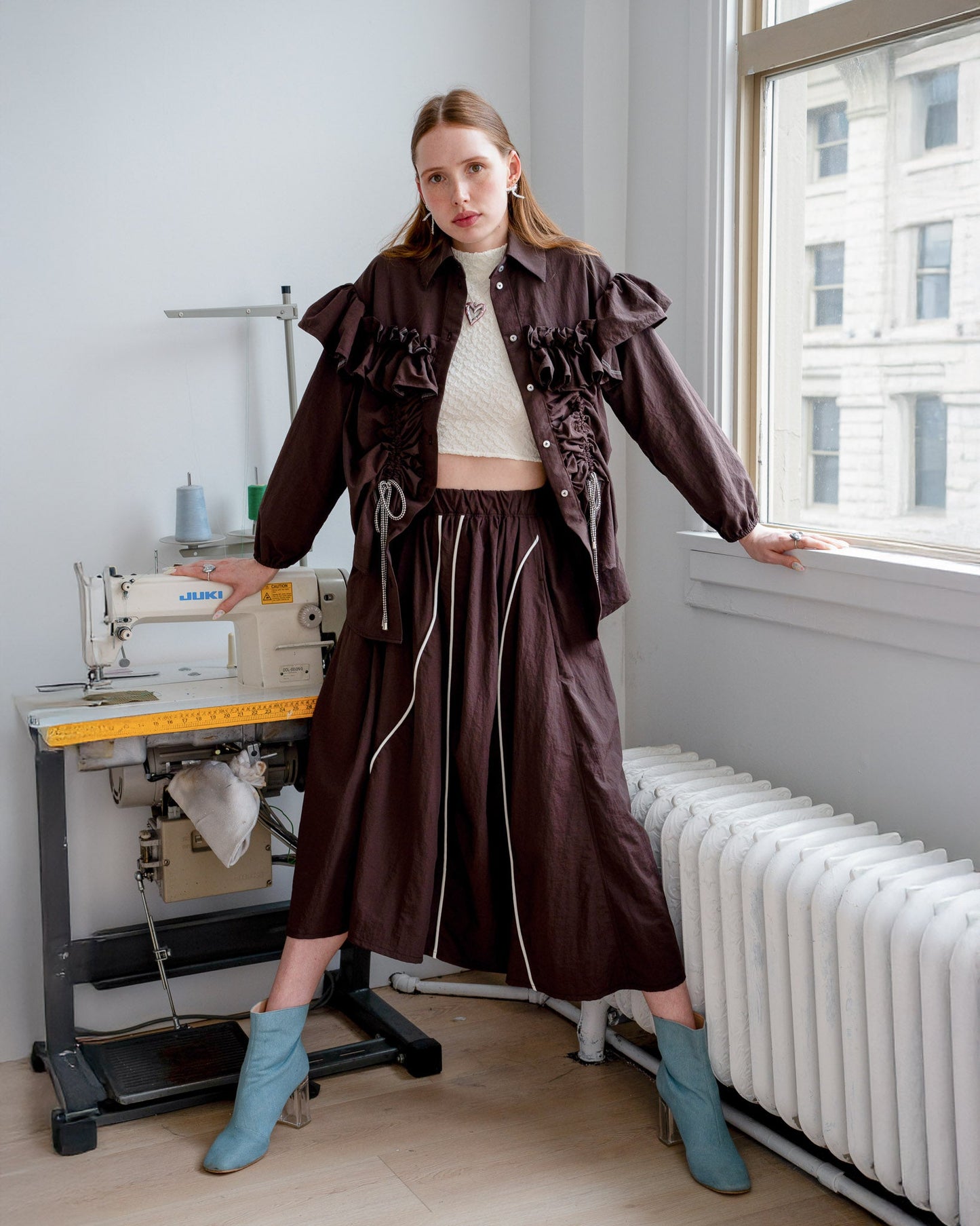 Model wearing the Riley Shirt with the built-in adjustable cords cinched for a fitted silhouette.