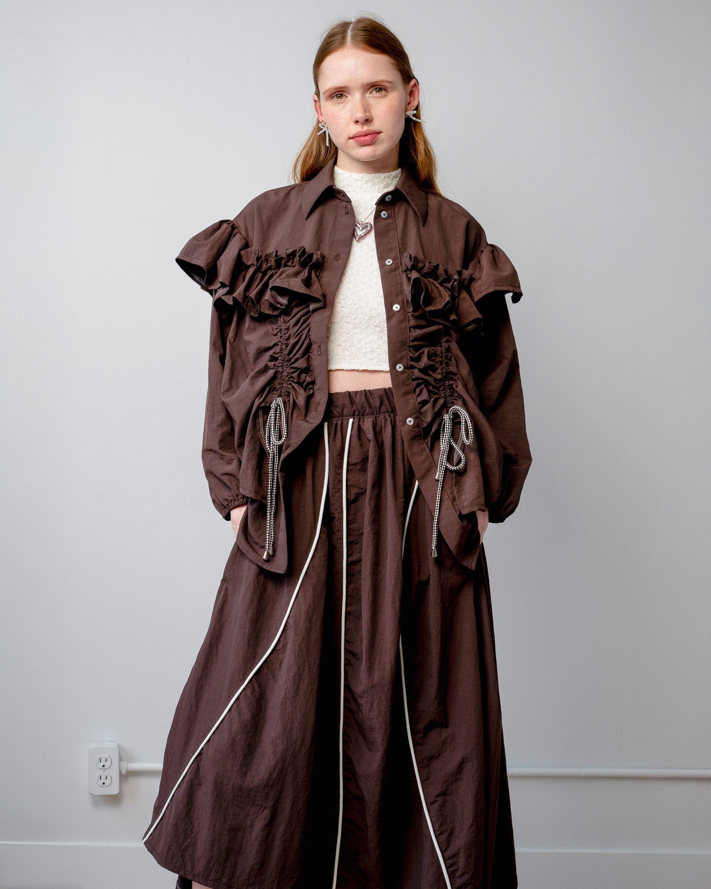 Model wearing the Riley Shirt with the built-in adjustable cords cinched for a fitted silhouette.