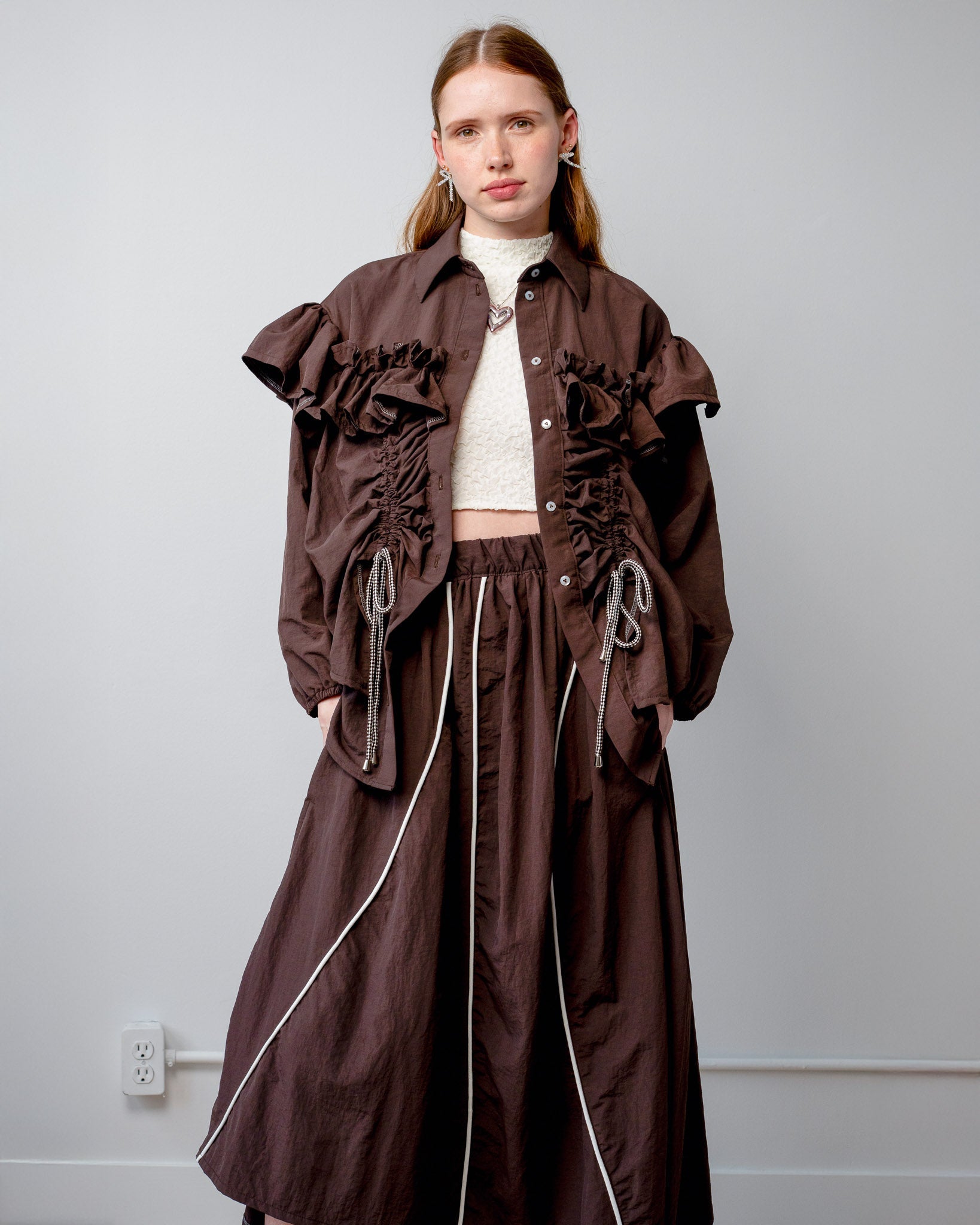 Model wearing the Riley Shirt with the built-in adjustable cords cinched for a fitted silhouette.